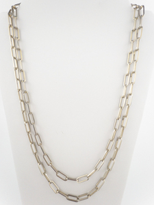lot 84 image: Paperclip Yellow Base Metal Opera Necklace.