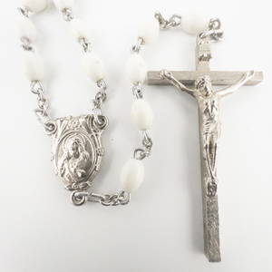 lot 87 image: White Beaded Base Metal Lariat Cross Necklace .