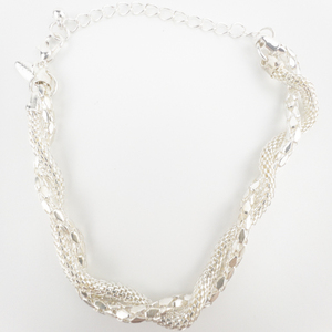 lot 89 image: Yves Rocher Twist Mesh Silver Tone Base Metal Necklace, Bracelet, & Dangle Earrings.