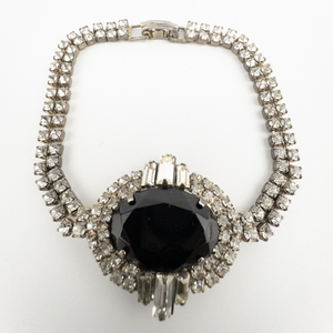 lot 99 image: Double Rhinestone With Large Black Center Statement Base Metal Bracelet.