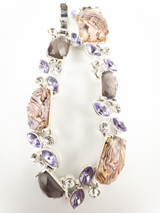 lot 110 image: Napier Purple Rhinestone Silver Tone Base Metal Panel Bracelet.