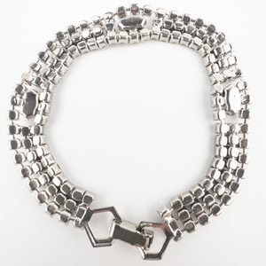 lot 114 image: 3 Strand Rhinestone Silver Tone Base Metal Bracelet.