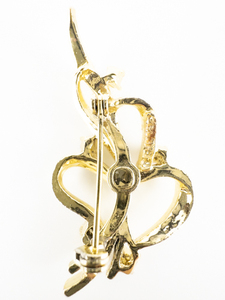 lot 121 image: Gerrys Twisted Ribbon Leaf With 5 Rhinestone Accents Gold Plated Base Metal Brooch.