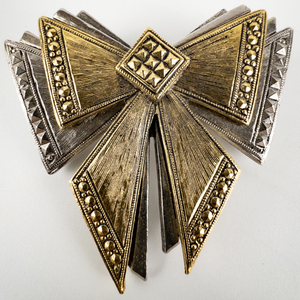 lot 129 image: AVON Matching Silver & Gold Tone Bow Base Metal Brooch & Stud Earrings.