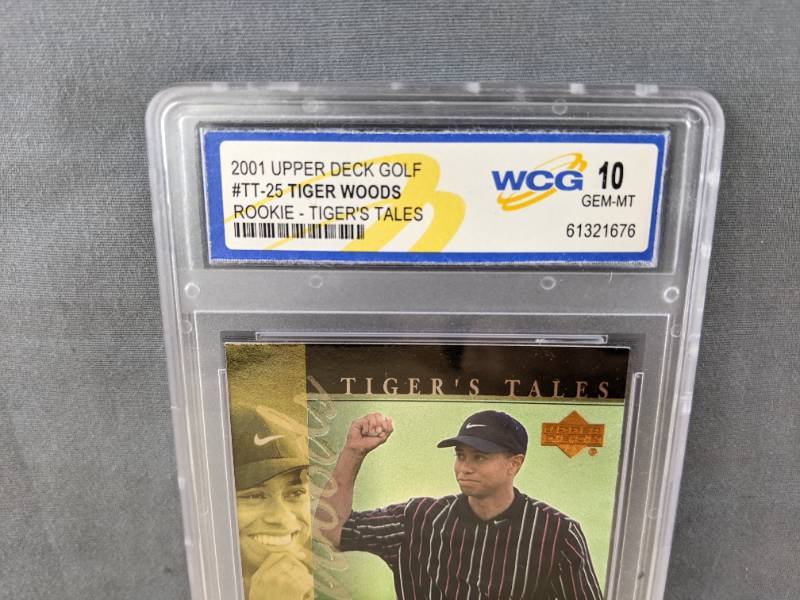 lot 31G image: Tiger Woods 2001 Upper Deck Golf WCG Graded 10 Rookie Tigers Tales Card #TT25 V