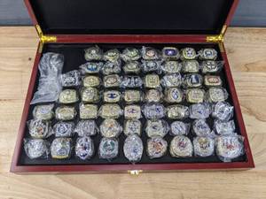 lot 1A image: WOW Brand New NFL Football Super Bowl Championship Ring Set, 57 Rings in Beautiful Display Case with Lombardi Trophy Packers Chiefs Raiders Patriots 49ers Brady Favre Namath Montana Mahomes O