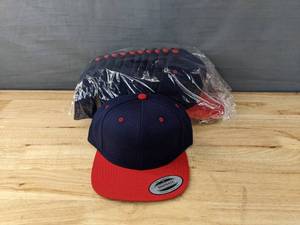 lot 115A image: 48 Brand New Yupoong Classics Navy and Red Hats OSFM A