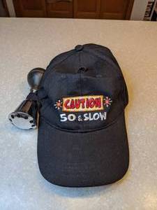 lot 432 image: New Caution 50 & Slow Birthday Hat Horn Pins Black Snap Back P
