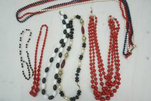 lot 48 image: Lot of beaded necklaces, one is Hong Kong