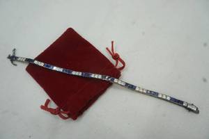 lot 92 image: Rhinestone and sapphire tennis bracelet .925