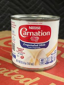 lot 23 image: CT 2 - Nestle Carnation Evaporated Milk Case - 24 Cans (5 fl oz each)
