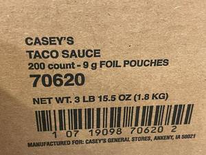 lot 34 image: Caseys Taco Sauce 200 Count - 9g Foil Pouches