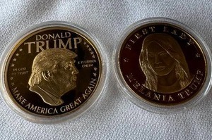 lot 15 image: COMMEMORATIVE DONALD TRUMP AND MELANIA COINS