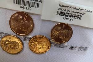 lot 64 image: 4 SACAGAWEA GOLD DOLLAR COINS