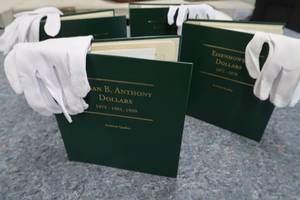 lot 99 image: 4 NEW SILVER DOLLAR ALBUMS
