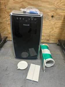 lot 89 image: HONEYWELL 10,000 BTU Portable Air Conditioner Cools 700 Sq. Ft. with Dehumidifier in Black and Silver