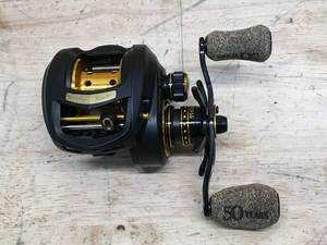 lot 122 image: Bass Pro Shops Johnny Morris Signature Series 50th Anniversary Baitcast Reel Model # JSG5010SHLA