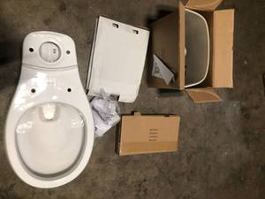 Glacier Bay 12 inch Rough In Two-Piece 1.1 GPF1.6 GPF Dual Flush Round Toilet in White Seat Included  Customer Returns See Pictures