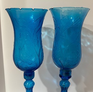 lot 29 image: Pair of Empoli Peacock Blue Floral Hurricane Candle Holders