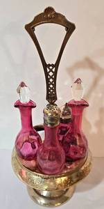 lot 116 image: Victorian Cranberry Glass Cruet Set with Silver-Plate Stand
