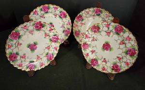 lot 136 image: Set of Four Japanese Floral China Plates with Wooden Stands