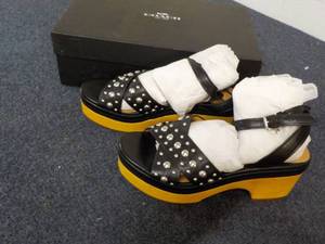 lot 92 image: Coach size 9 Astor Studded Matte Calf Black Sandals - New