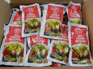 lot 195 image: 5 lb. 10 oz box Red French Dressing - individual single packets