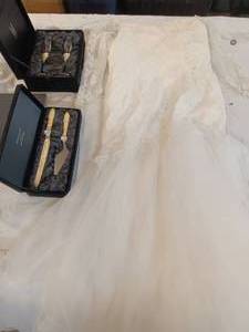 lot 27 image: Wedding dress and personalized serving wear and champagne glasses in velvet boxes