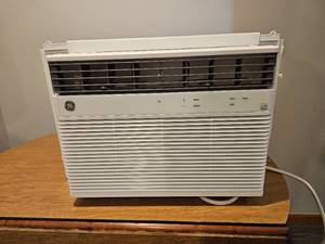 lot 73 image: Rugged GE Air Conditioner Window Unit