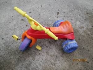 lot 14 image: Fisher Price toddler 3-wheel peddle...