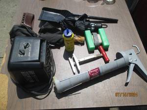 lot 137 image: Caulking gun, rain umbrellas and ot...