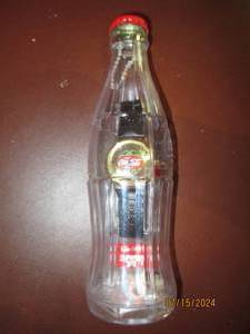 lot 146 image: Coca-Cola Collectible watch with bo...
