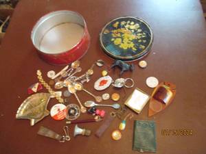 lot 151 image: Vintage covered tin with an assortm...