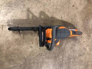 lot 34 image: RIDGID 18V Brushless 12 in. Electric Battery Chainsaw (Tool Only)  Customer Returns See Pictures