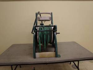 lot 75 image: Garden Hose Reel Cart with Hose