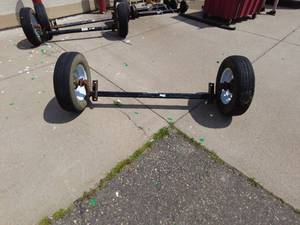 lot 300 image: LippertTrailer Axle with Tires Ranier ST20575R15 3500# capacity