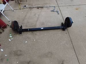lot 305 image: New Lippert Trailer Axle with Electric Brake Drums 4500# capacity