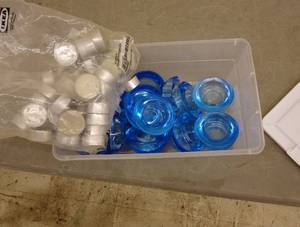 lot 161 image: Set of 100 GLIMMA Tea Light Candles with 11 Blue Tealight Holders
