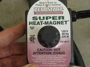 lot 185 image: battery float charger & heat magnet