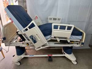 lot 7 image: Stryker Secure II Power Motorized Adjustable 500lb Capacity Hospital Nursing Home In-Home Health Patient Care Bed Built In Weight Scale & Bed-Exit Alarm Plugs Into Regular Light Socket Free Used High Quality Mattress - Works Great