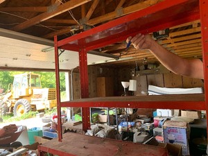 red metal shelves, table, stool