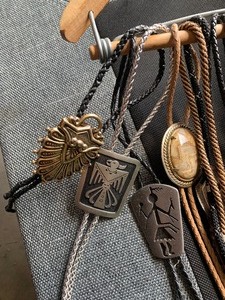 Belts and tie bolos