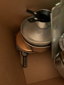 Box of kitchen cookware, pans, glassware, grinder