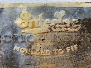 lot 171 image: Antique 1920s era INTERLOC Tire Embossed Tin Sign