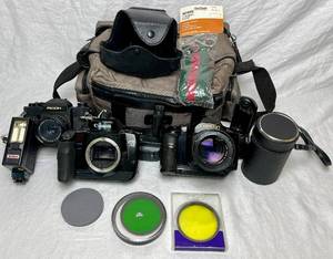 lot 76 image: Vintage Camera Bundle - Canon T90, Canon EOS A2 and Ricoh SLX 500 plus lens, filters, battery grip, power drive booster and accessories
