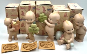 lot 286 image: 1990s ENESCO CORPORATION - THE ROSE ONEILL KEWPIE COLLECTION Porcelain Dolls including Erin Go Bragh - Qty 5