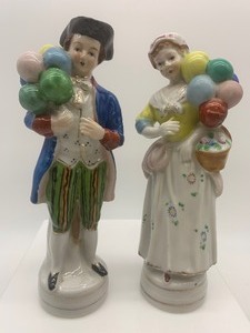 lot 299 image: 2 COLONIAL Figurines, Woman and Man with Balloons
