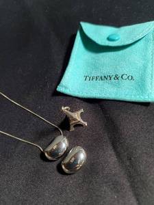 lot 306 image: Tiffany & Co. Jewelry Set - Bean Pendant Necklace & Eiffel Tower Charm