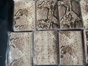 lot 650 image: Lot of 14 Snake Print Wallets