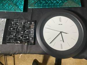 lot 664 image: Decorative Glass Plates, Acrylic Stand, and Wall Clock Set